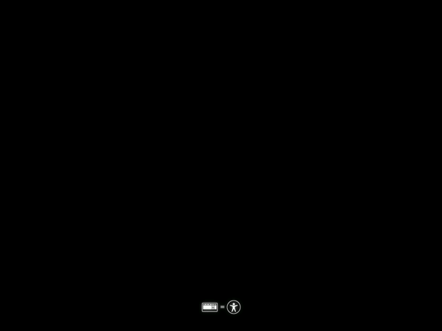 The first boot screen is displayed, showing keyboard and accessibility icons at the bottom.
