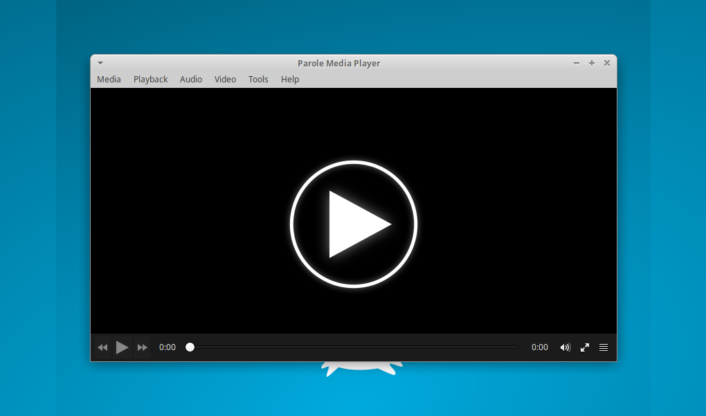 The main Parole Media Player window features a large play icon in the middle of a dark background.